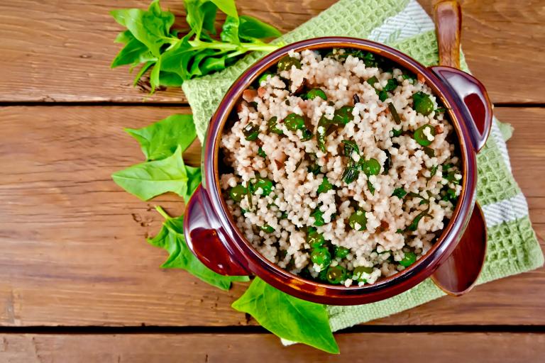 a bowl of quinoa and spinach